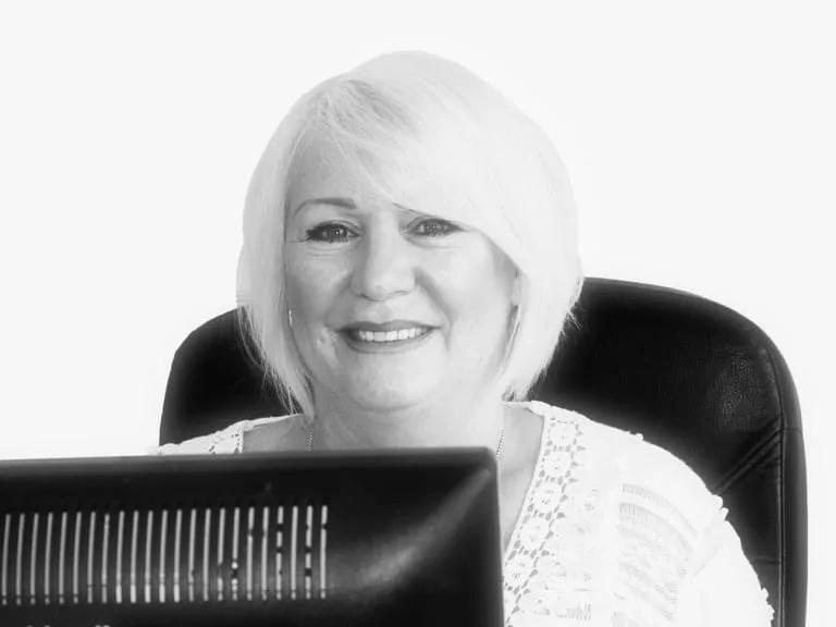 Spine Plus reception, ready to take your call and help you book an appointment
